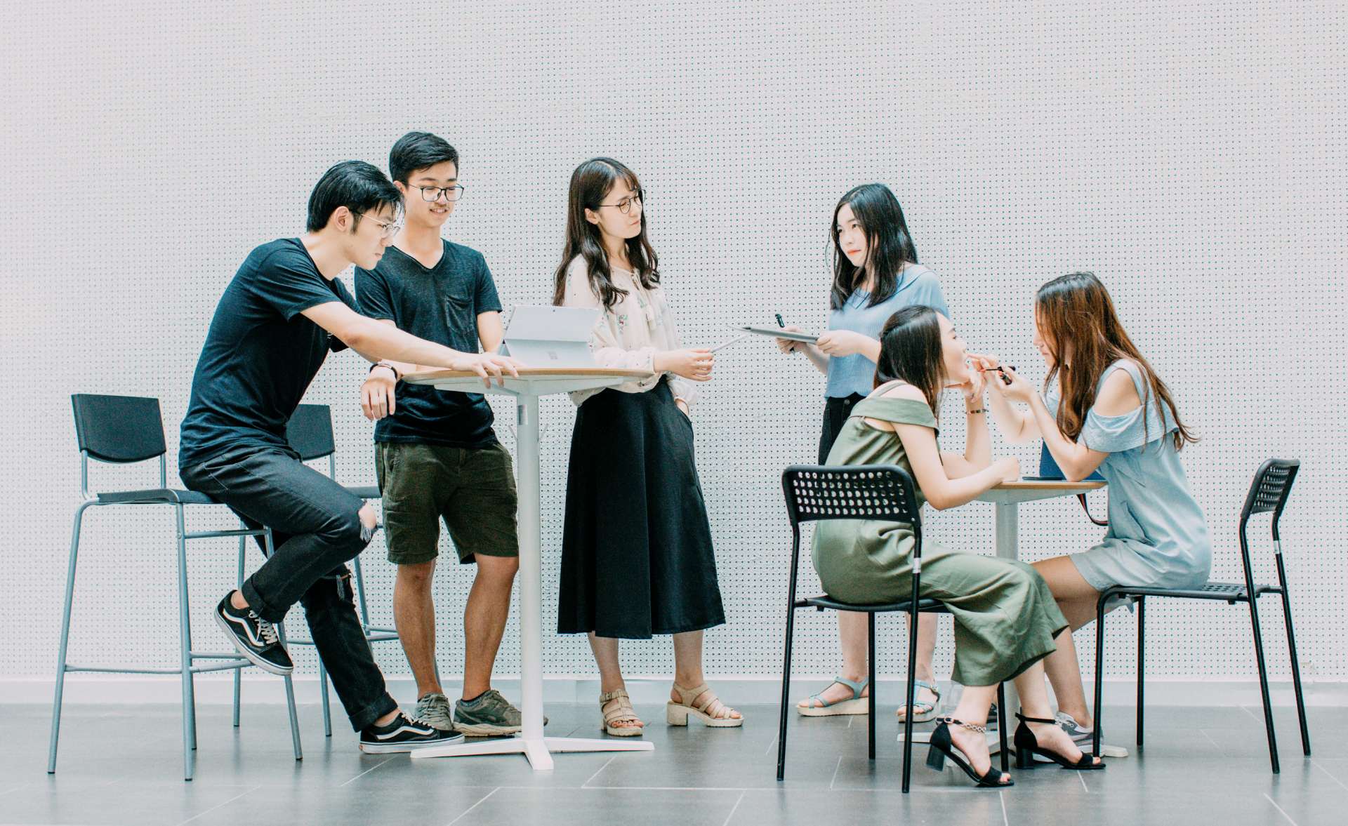 Group discussing ideas in modern office setting